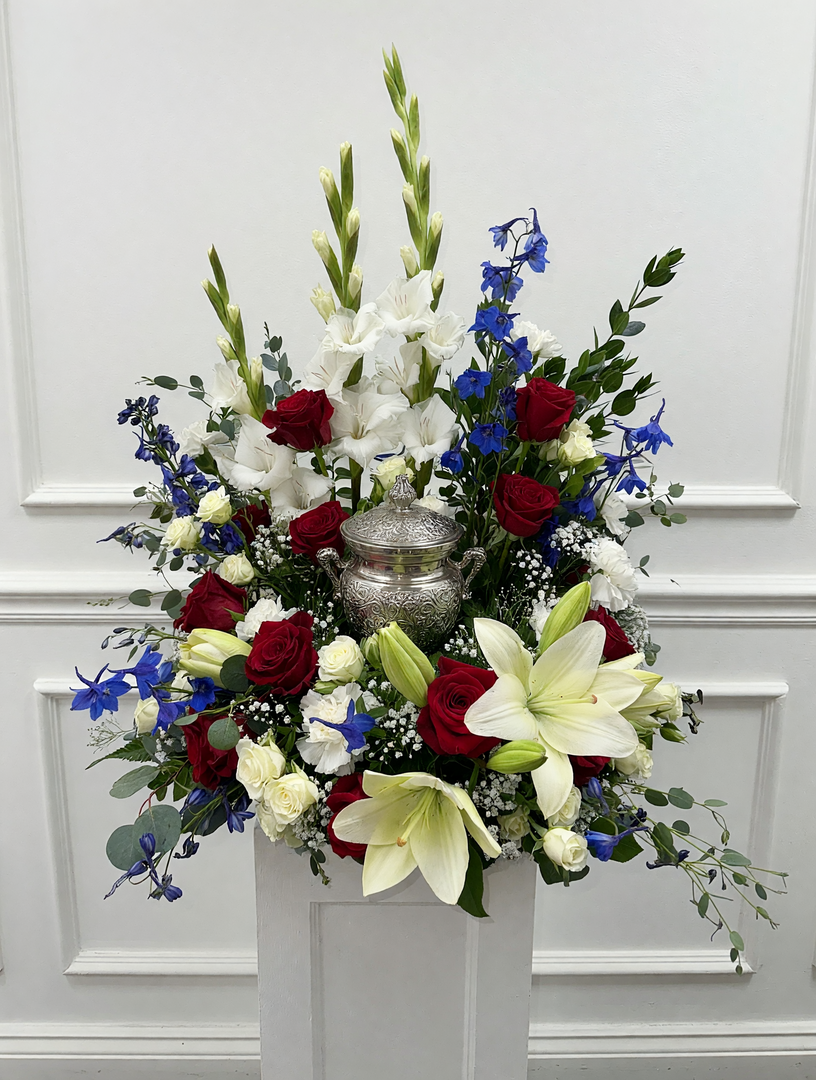 A red, white, and blue memorial made by Woodland Floral in Kalispell, MT