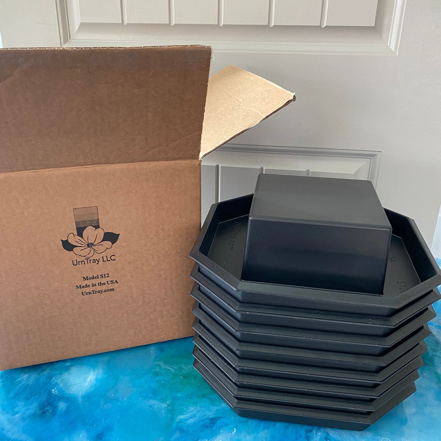 Each box of 8-pak UrnTrays stacked in a 12" X 12" x 12" box