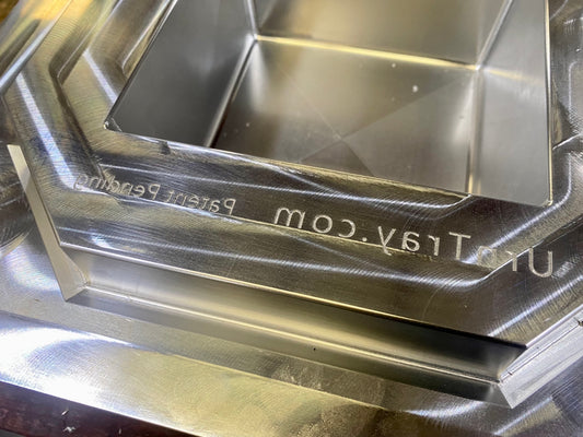 The mold of an urntray is made out of metal.