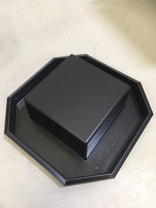 Plain UrnTray container that is made of black styrene plastic with UrnTray.com Patent Pending molded in the bottom for future reference of where to order.  Made in the USA is also molded into the plastic on the opposite side..